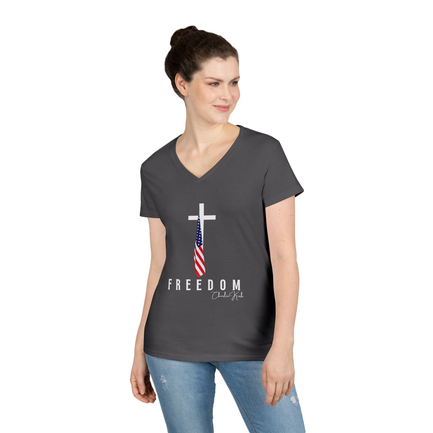 Woman wearing a dark gray t-shirt with a cross and American flag design, text 'FREEDOM' on a white background.