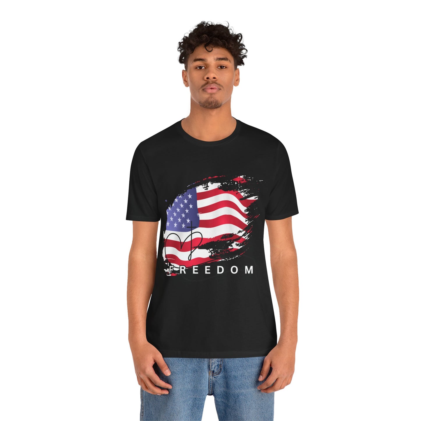 Person wearing a black t-shirt with an American flag and 'Freedom' text