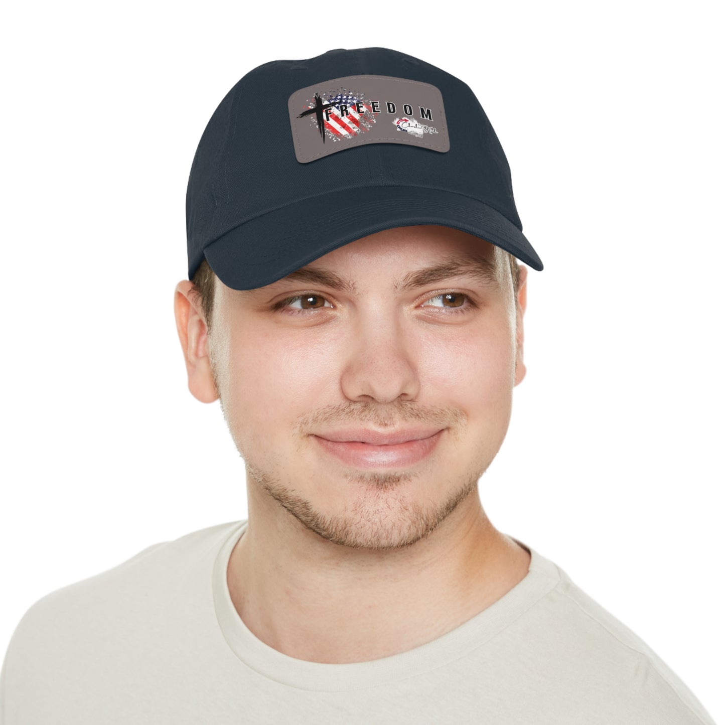 Man wearing a navy blue cap with a Freedom Turning Point Charlie Kirk Patch