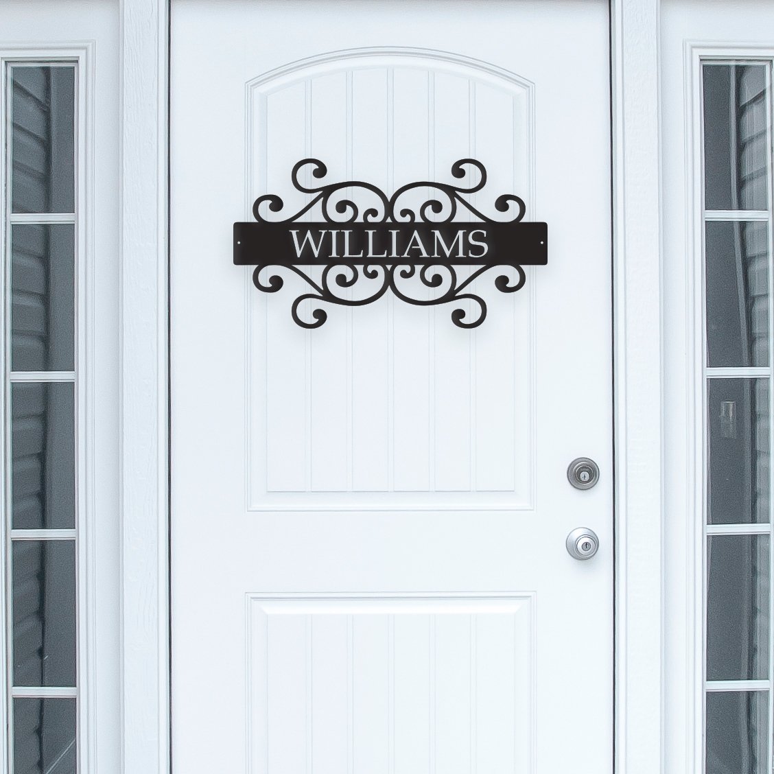 White door with decorative nameplate decal reading 'Williams'