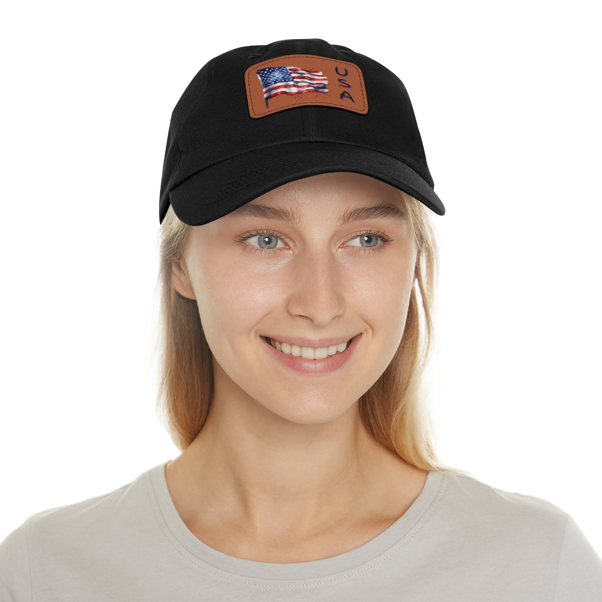 Woman wearing a black cap with a tan American flag patch