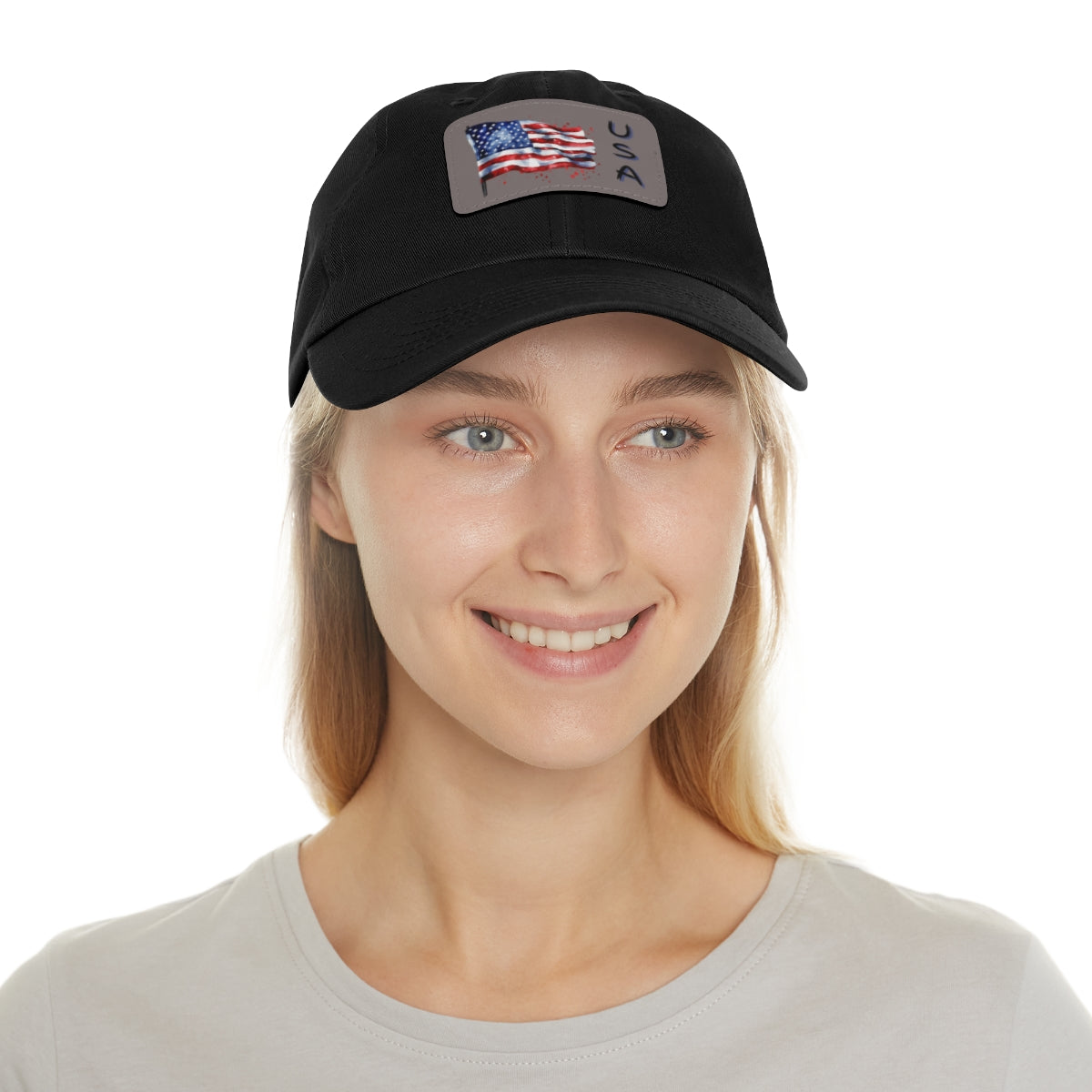 Woman wearing a black cap with a grey American flag patch
