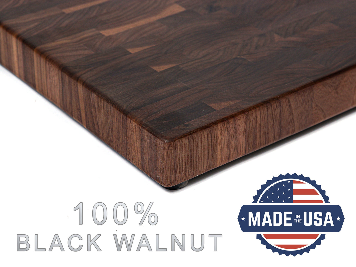 Wooden cutting board with '100% Black Walnut' text and 'Made in the USA' badge on a white background