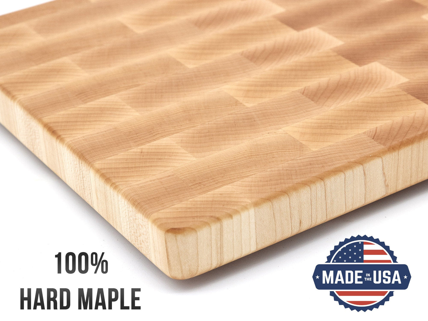 Wooden cutting board with '100% Hard Maple' text and 'Made in USA' logo on a white background