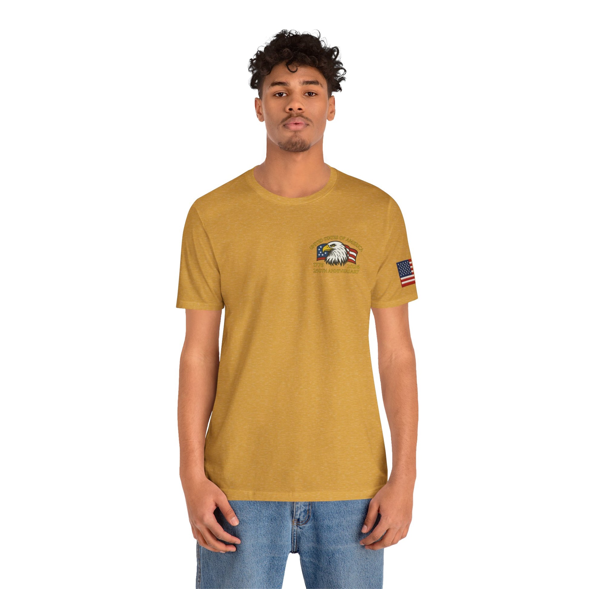Man wearing a mustard yellow t-shirt with an eagle and flag patch