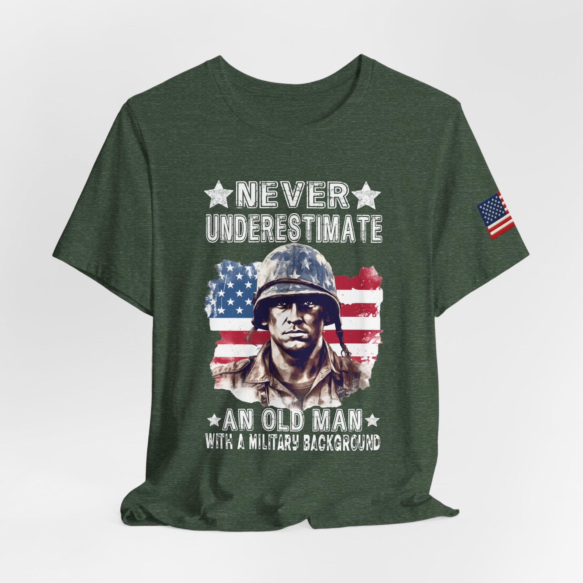 Green t-shirt with a graphic of a soldier and American flag, text 'Never Underestimate an Old Man with a Military Background'