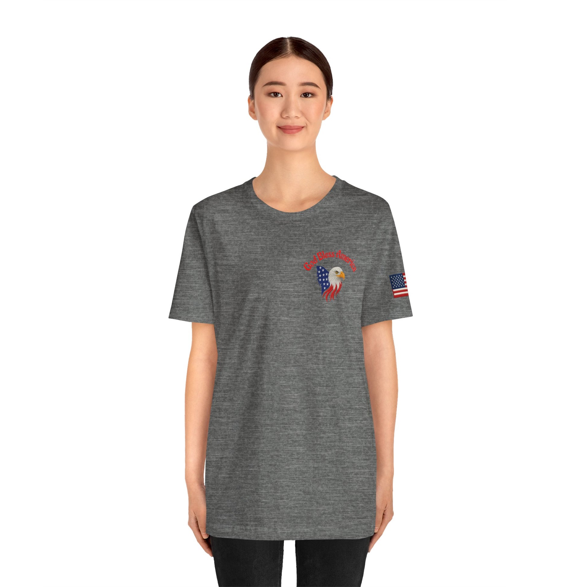 Person wearing a gray t-shirt with a design