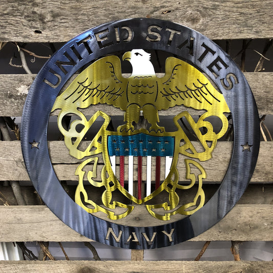 Metal plaque with 'United States Navy' emblem on a wooden background