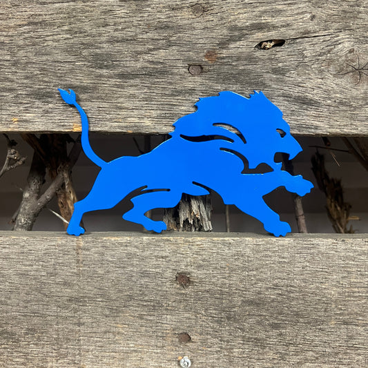 Blue lion silhouette on a wooden background