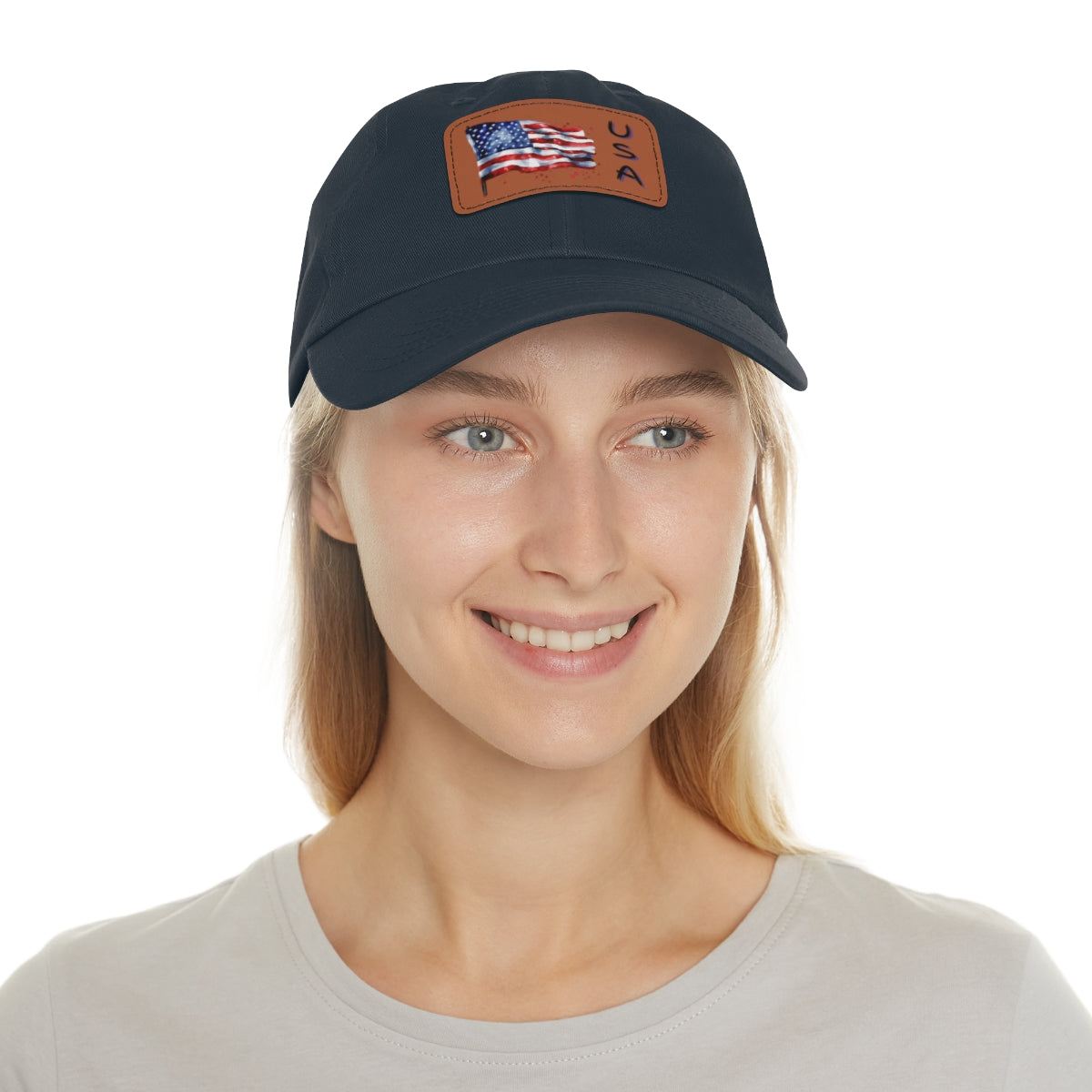 Woman wearing a navy blue cap with a tan American flag patch