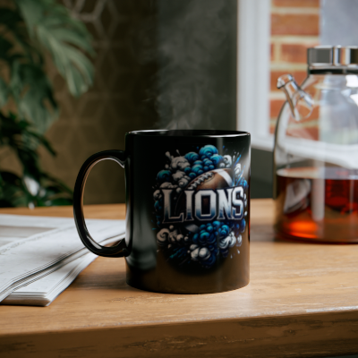 Black mug with 'Lions' design on a wooden table with steam rising from it.