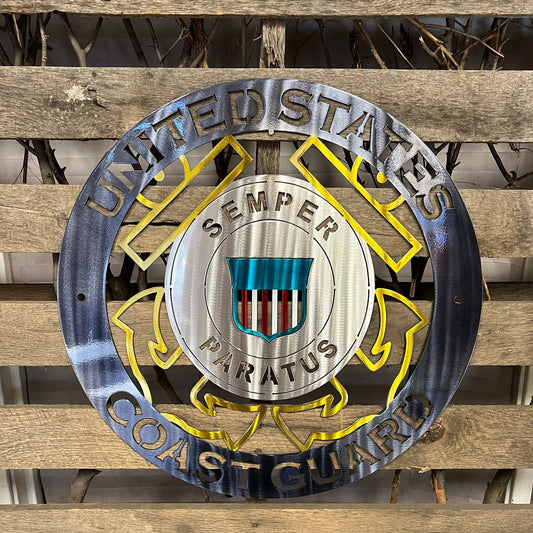 Metal plaque with the United States Coast Guard emblem on a wooden background