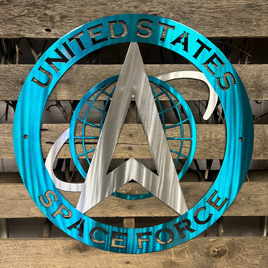 Decorative sign with 'United States Space Force' text and logo on a wooden background