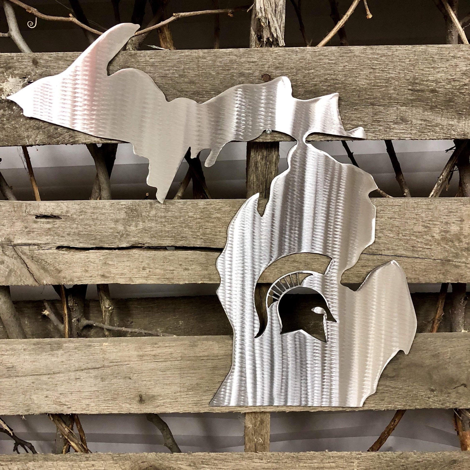 Metal Spartan helmet design on a wooden background