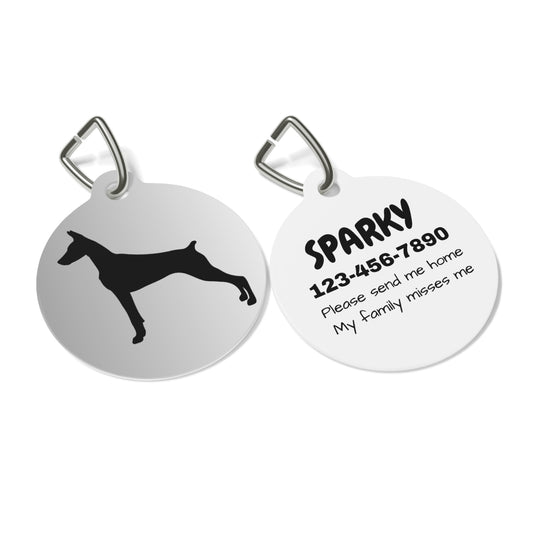 Two dog tags with a silhouette of a dog and text on a white background