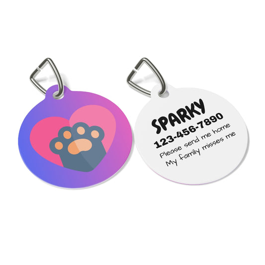 Two pet tags, one with a heart and paw design, the other with text and contact information.